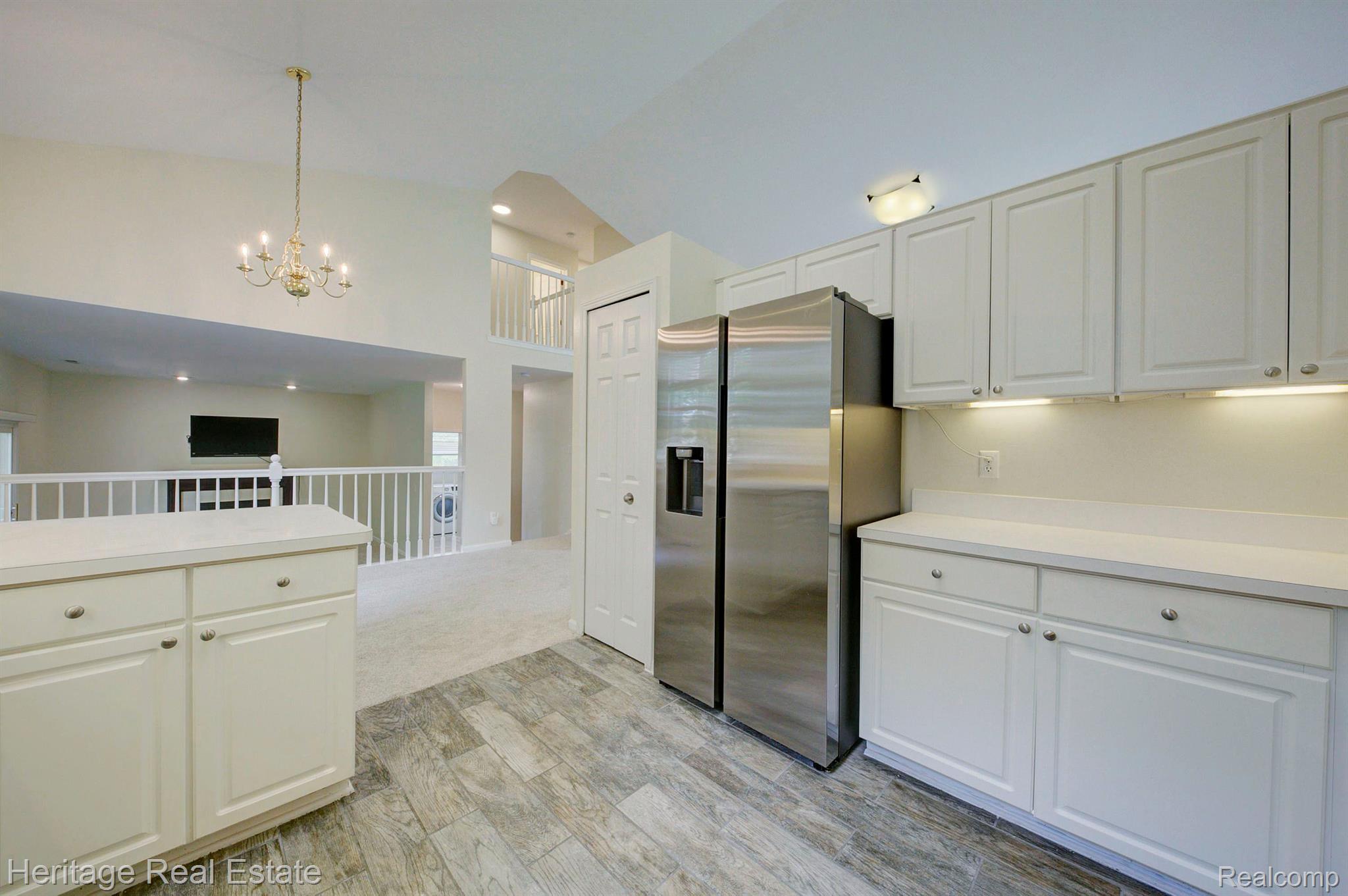 117 Eagle Ridge Road Lake Orion, MI 48360 - Photo 15 of 61 Pantry next to the refrigerator for extra storage
