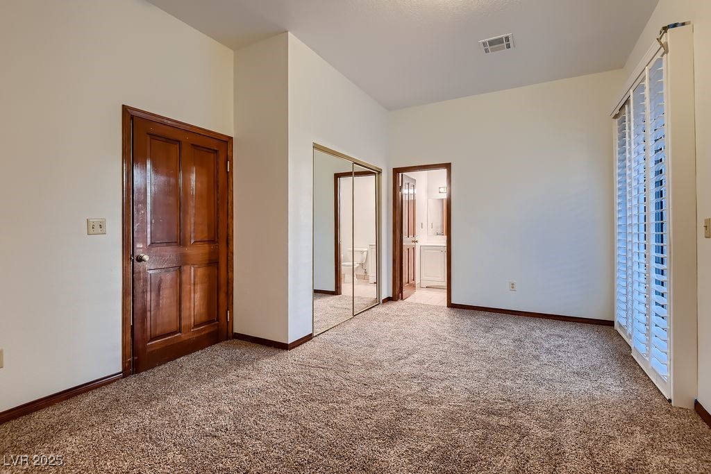 1 Quail Run Road Henderson, NV 89014 - Photo 28 of 82 1st floor guest bedroom with full bath and slider access to the yard