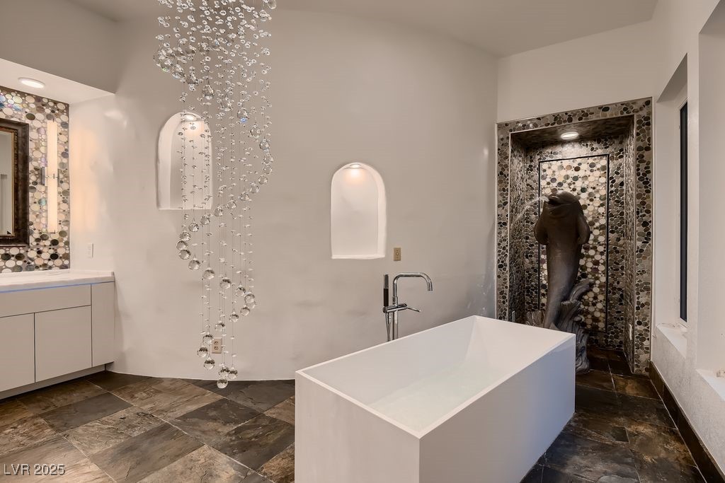 1 Quail Run Road Henderson, NV 89014 - Photo 39 of 82 Free standing 72 gallon tub, fill using regular fixture or the 5" tall dolphin behind the tub