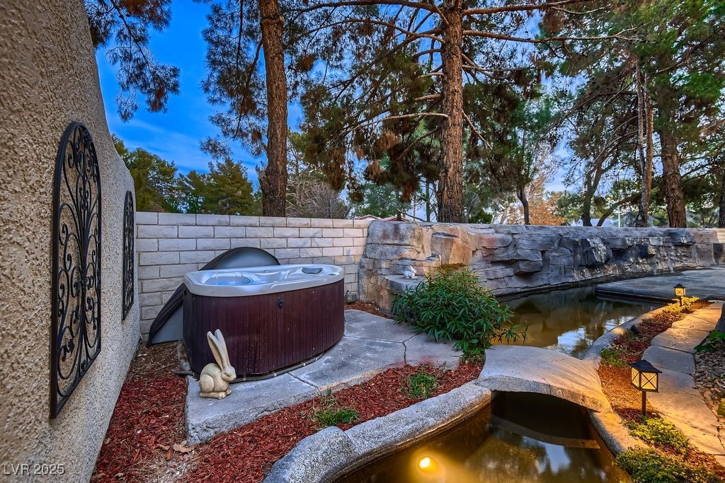 1 Quail Run Road Henderson, NV 89014 - Photo 41 of 82 Separate above ground spa, 20' custom sculptured rock drip waterfall to the left