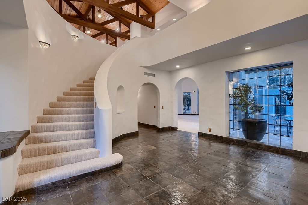 1 Quail Run Road Henderson, NV 89014 - Photo 42 of 82 Curved stairway from front entry to the 2nd floor