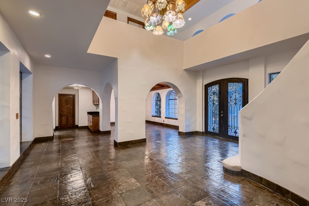 1 Quail Run Road Henderson, NV 89014 - Photo 7 of 82 One of a kind hand blown glass chandelier shines over the entry