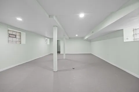 an empty room with a empty space and windows