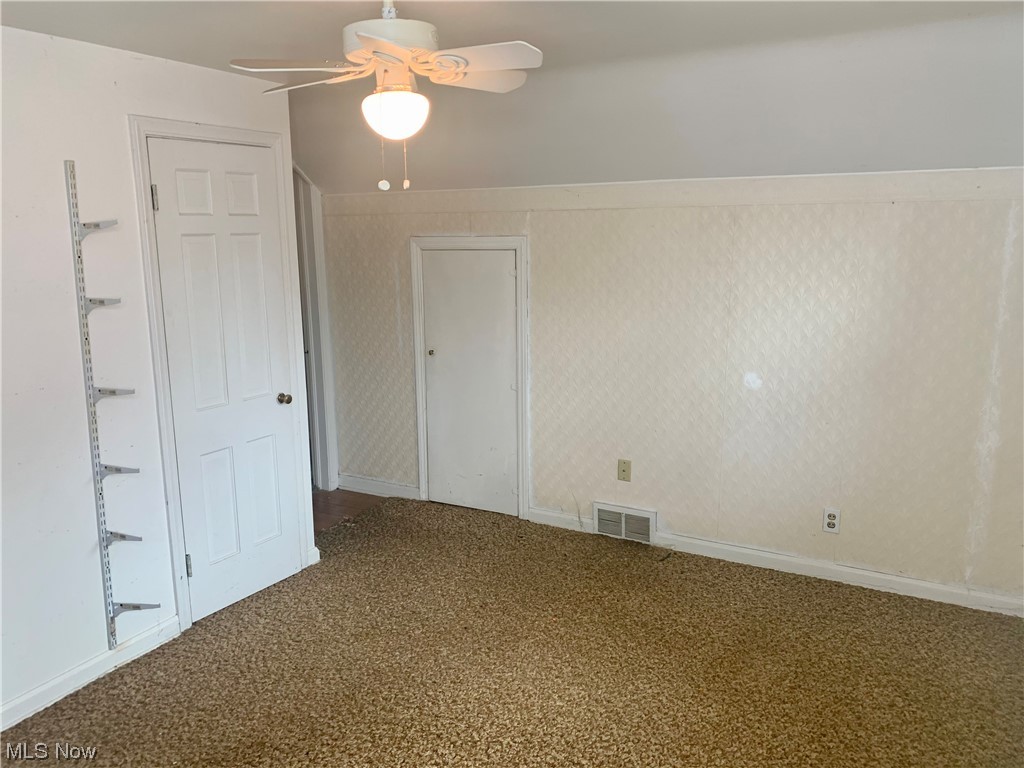 665 Dorchester Road Akron, OH 44320 - Photo 15 of 18 Carpeted spare room with ceiling fan