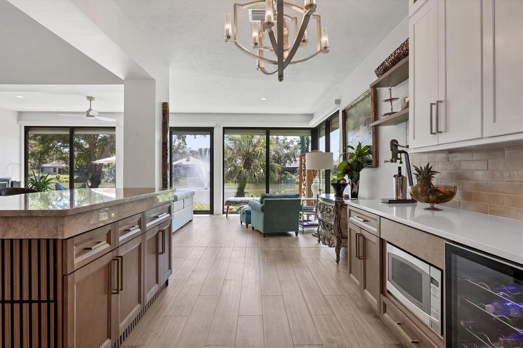 17 Bayhead Lane Osprey, FL 34229 - Photo 11 of 37 a kitchen with lots of counter top space and wooden floor