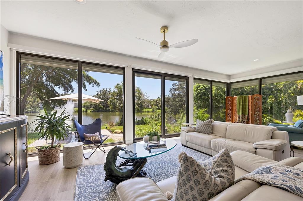 17 Bayhead Lane Osprey, FL 34229 - Photo 12 of 37 a living room with furniture and a large window