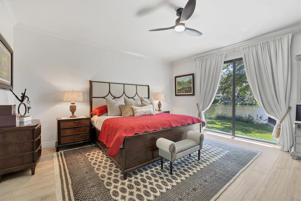 17 Bayhead Lane Osprey, FL 34229 - Photo 15 of 37 a bedroom with a bed and wooden floor