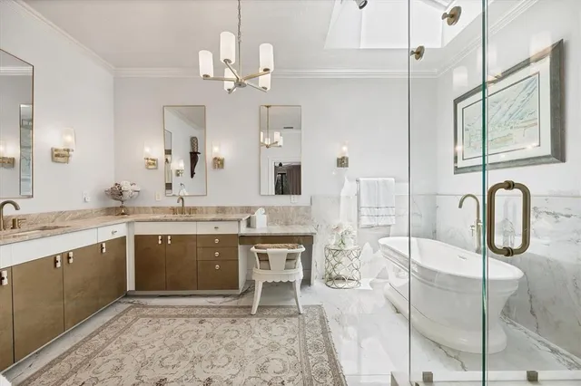 a spacious bathroom with a granite countertop sink a mirror and a shower