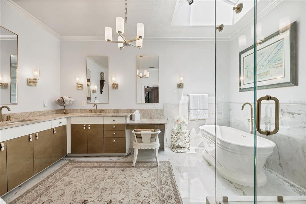 17 Bayhead Lane Osprey, FL 34229 - Photo 17 of 37 a spacious bathroom with a granite countertop sink a mirror and a shower