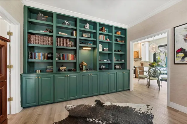 a room with cabinets and a book shelf