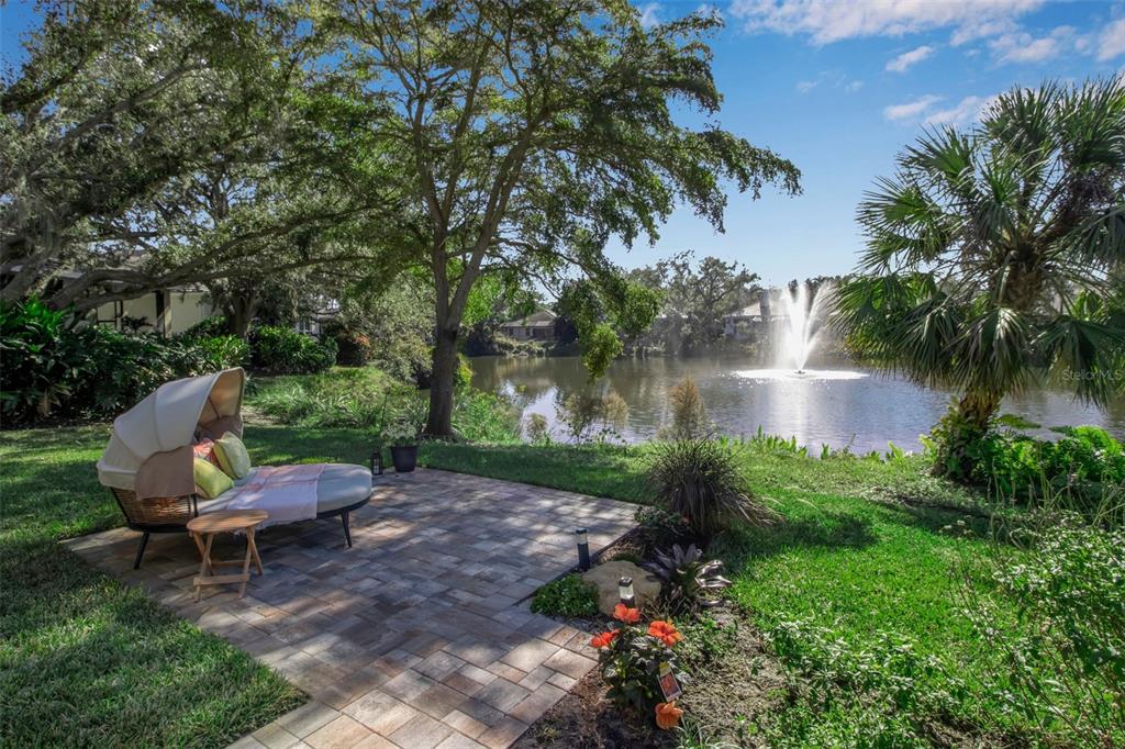 17 Bayhead Lane Osprey, FL 34229 - Photo 27 of 37 a view of a backyard with plants and a patio