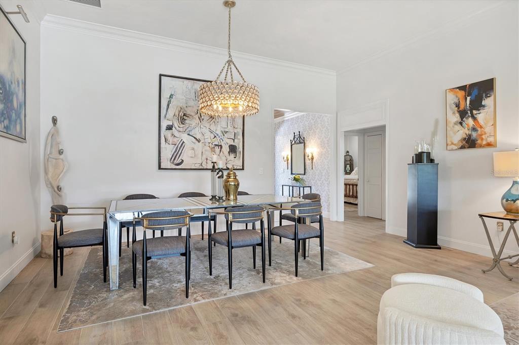 17 Bayhead Lane Osprey, FL 34229 - Photo 3 of 37 a view of a dining room with furniture window and wooden floor