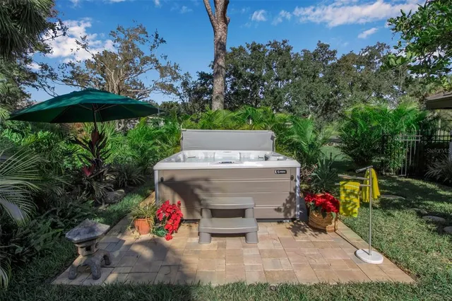 an outdoor space with furniture and umbrella