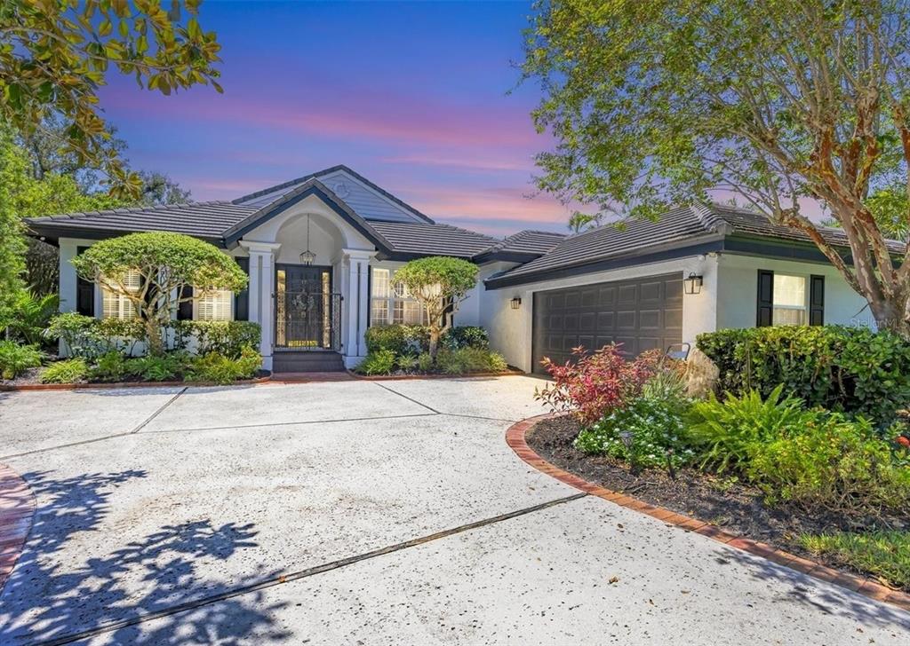 17 Bayhead Lane Osprey, FL 34229 - Photo 34 of 37 front view of a house with a yard
