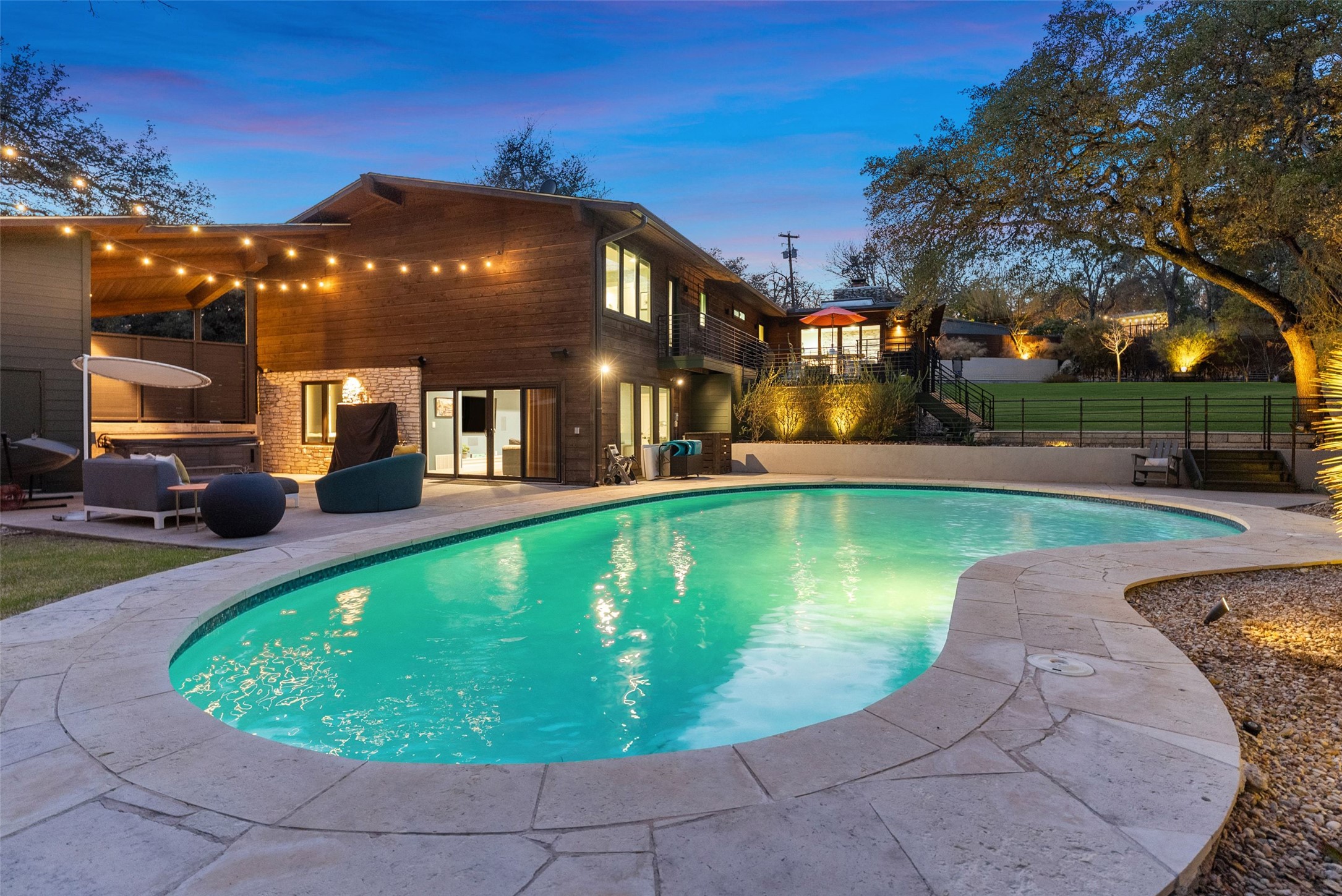 a view of a swimming pool with a patio