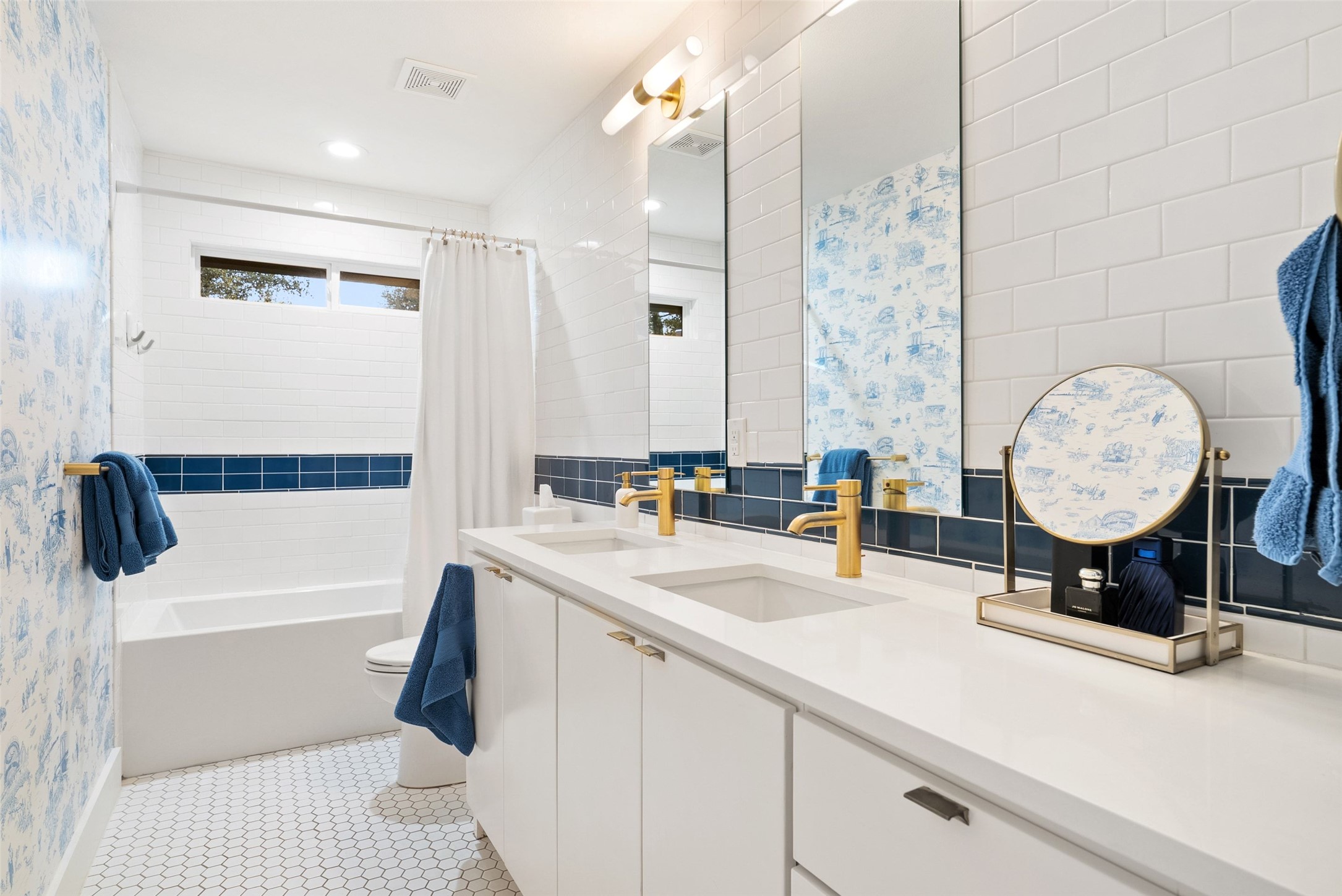 3302 Cherry Tree Circle Austin, TX 78731 - Photo 20 of 37 a bathroom with a sink double vanity and a mirror