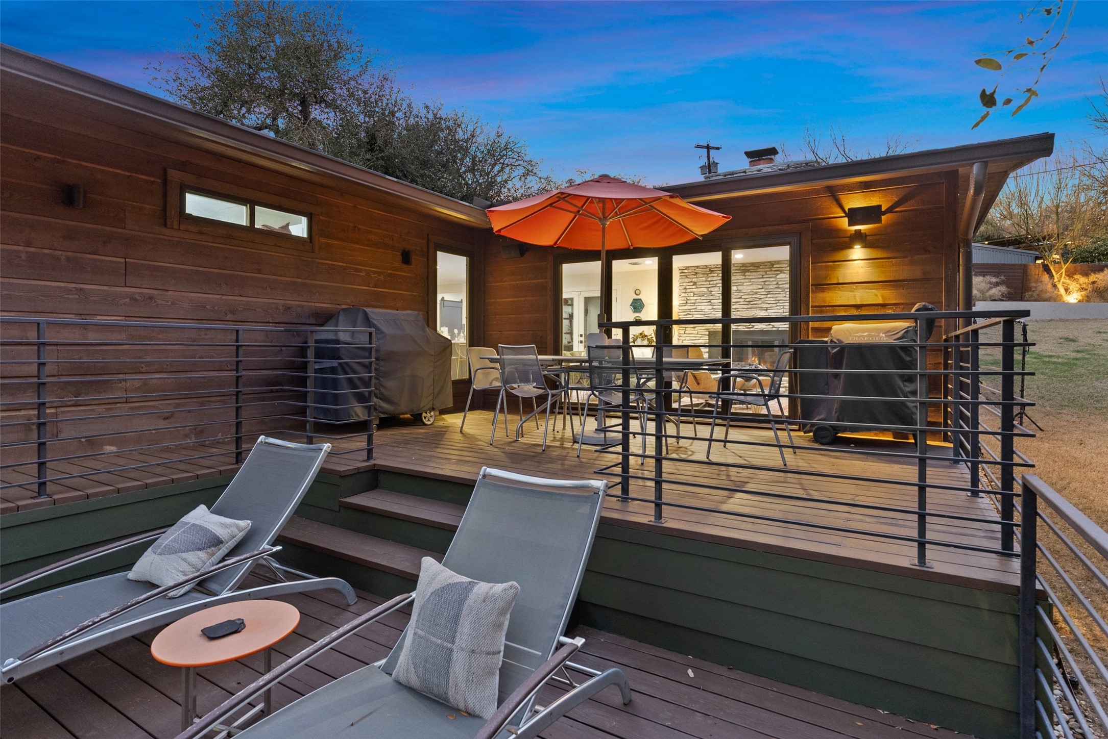 3302 Cherry Tree Circle Austin, TX 78731 - Photo 28 of 37 a view of a patio with table and chairs with wooden floor and fence