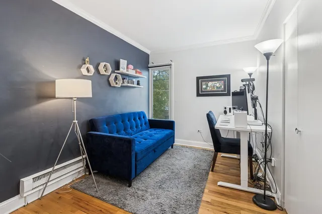 a living room with furniture and a rug