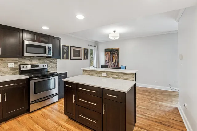 a kitchen with a stove and a microwave