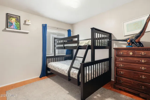 a bedroom with furniture and a window