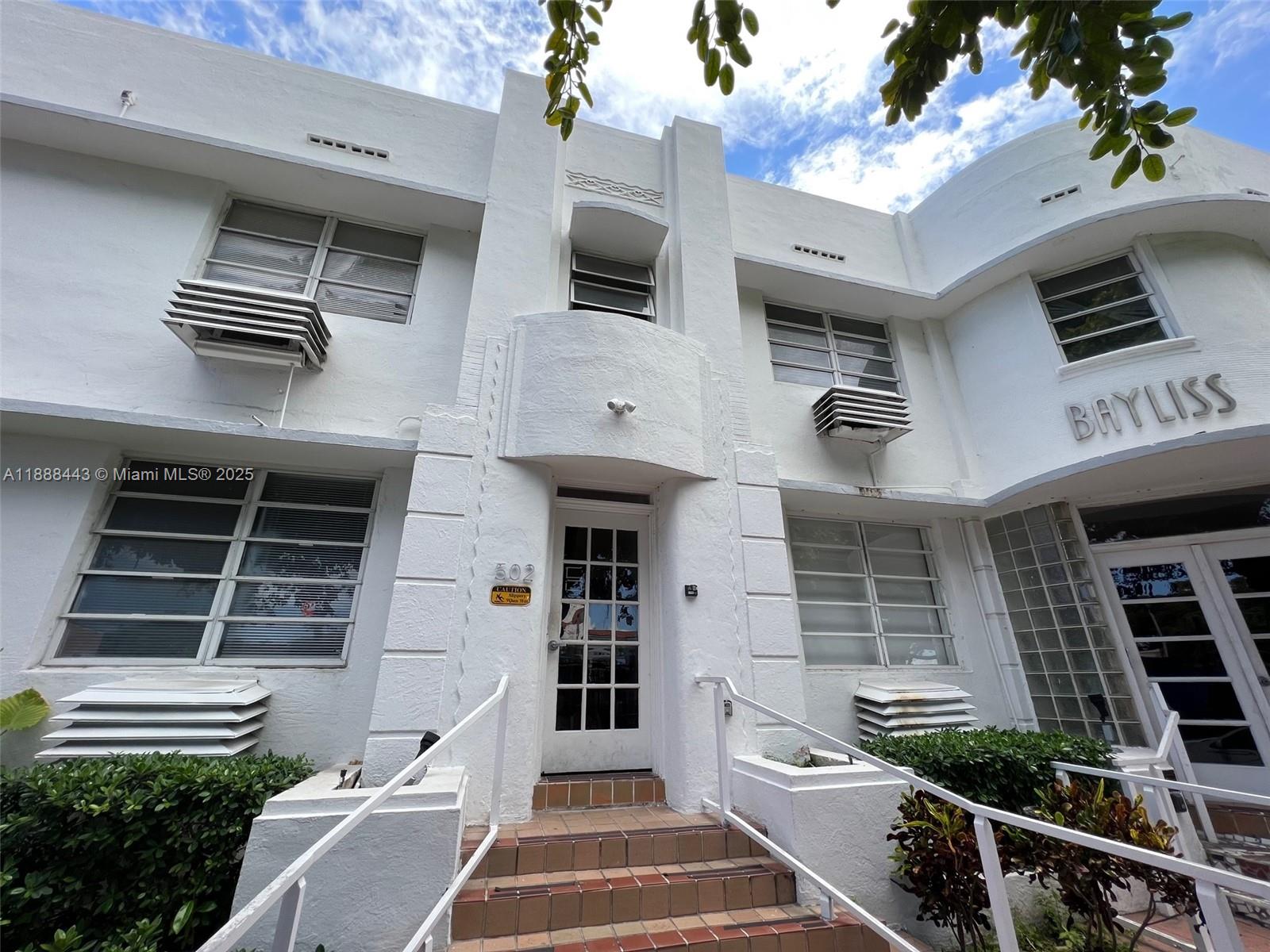 500 14th Street, Unit 105 Miami Beach, FL 33139 - Photo 10 of 10 a front view of a house with a yard