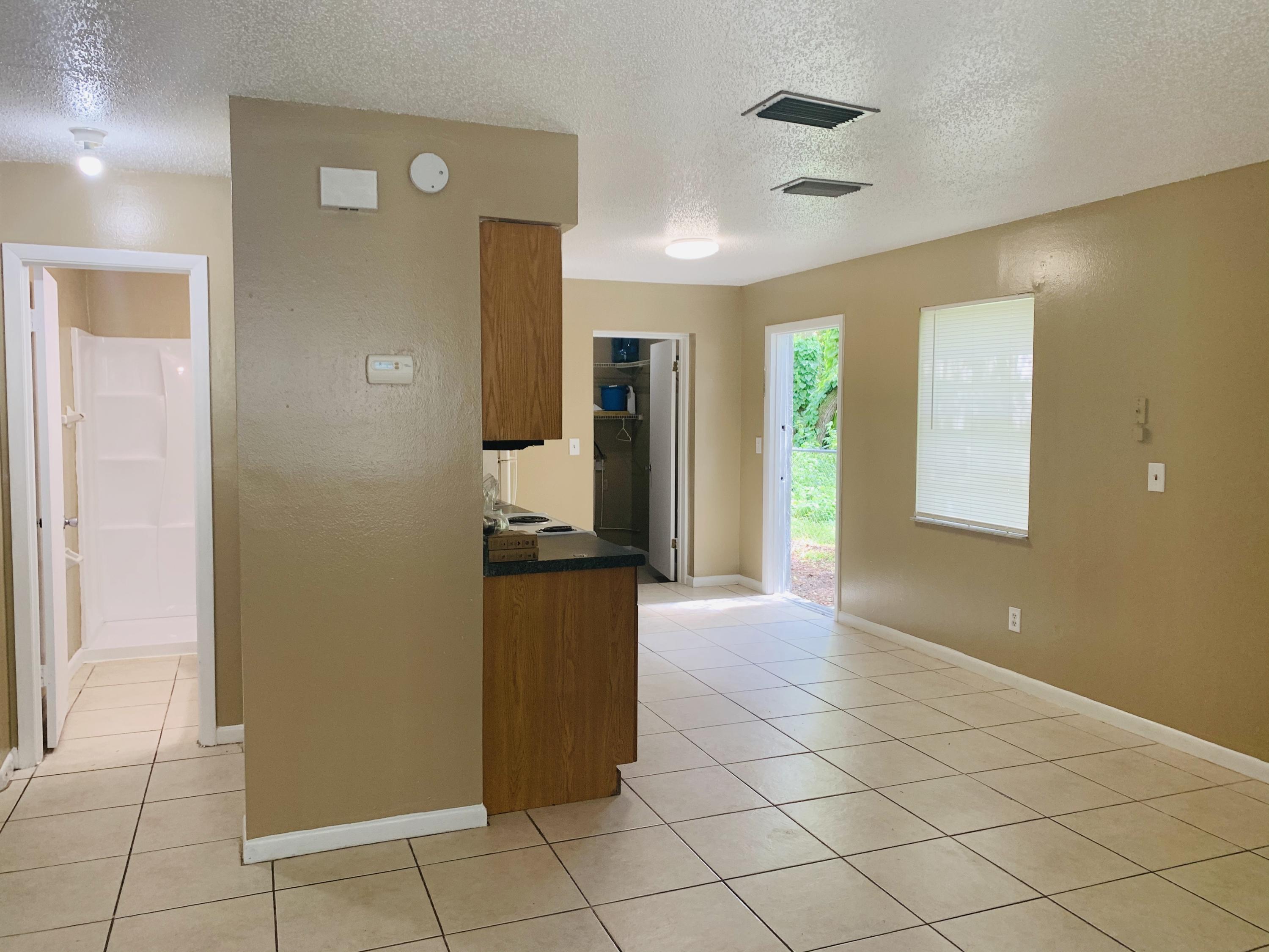 3370 Northwest 40th Drive Okeechobee, FL 34972 - Photo 12 of 14 a view of a hallway with wooden cabinets