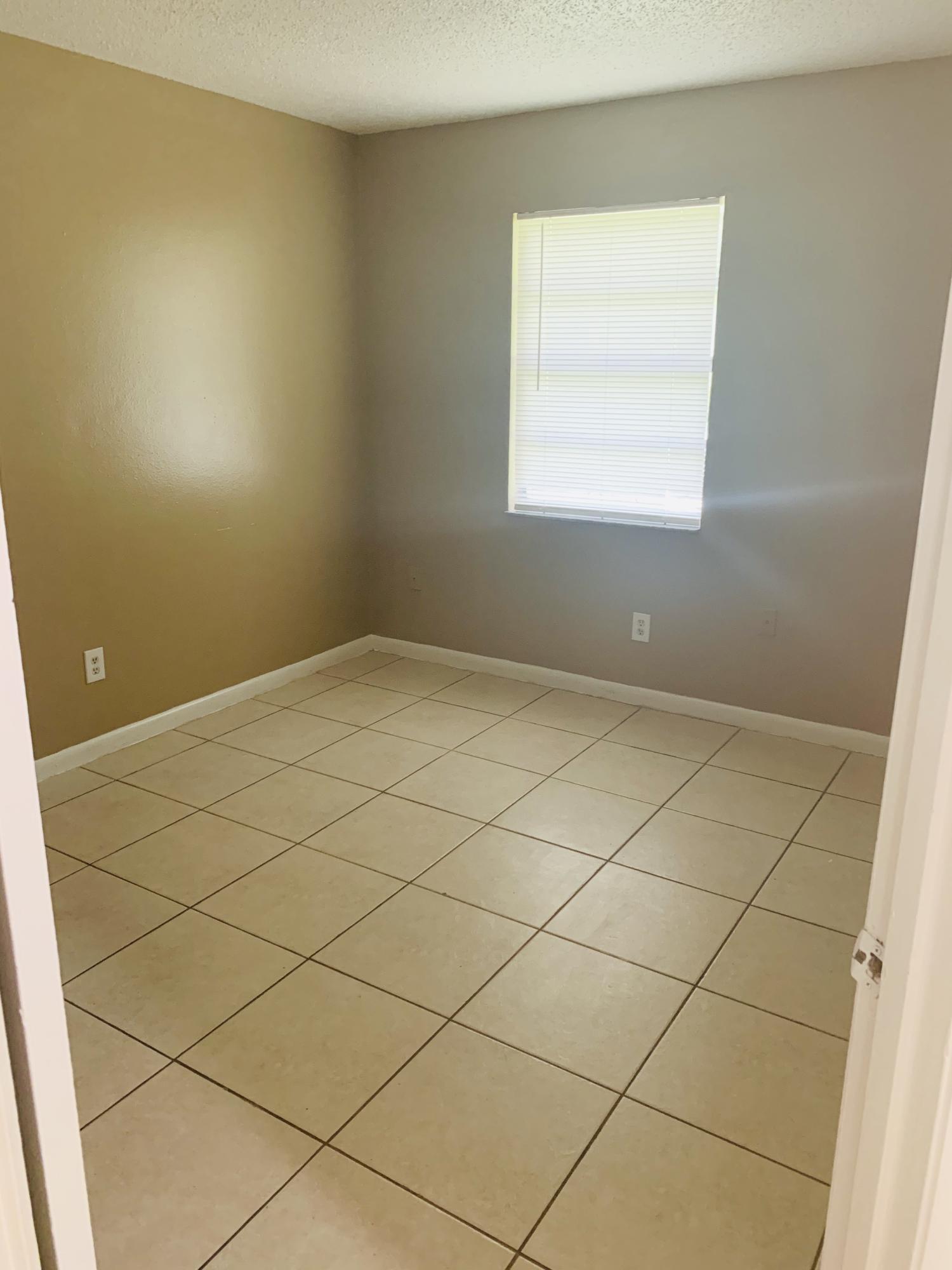 3370 Northwest 40th Drive Okeechobee, FL 34972 - Photo 3 of 14 a view of a room with windows