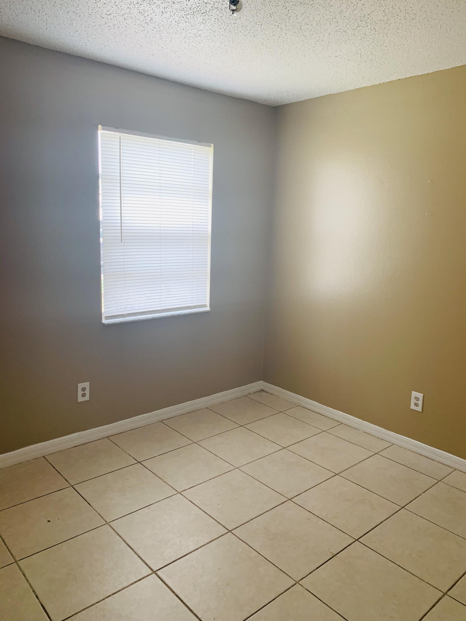 3370 Northwest 40th Drive Okeechobee, FL 34972 - Photo 6 of 14 an empty room with a window