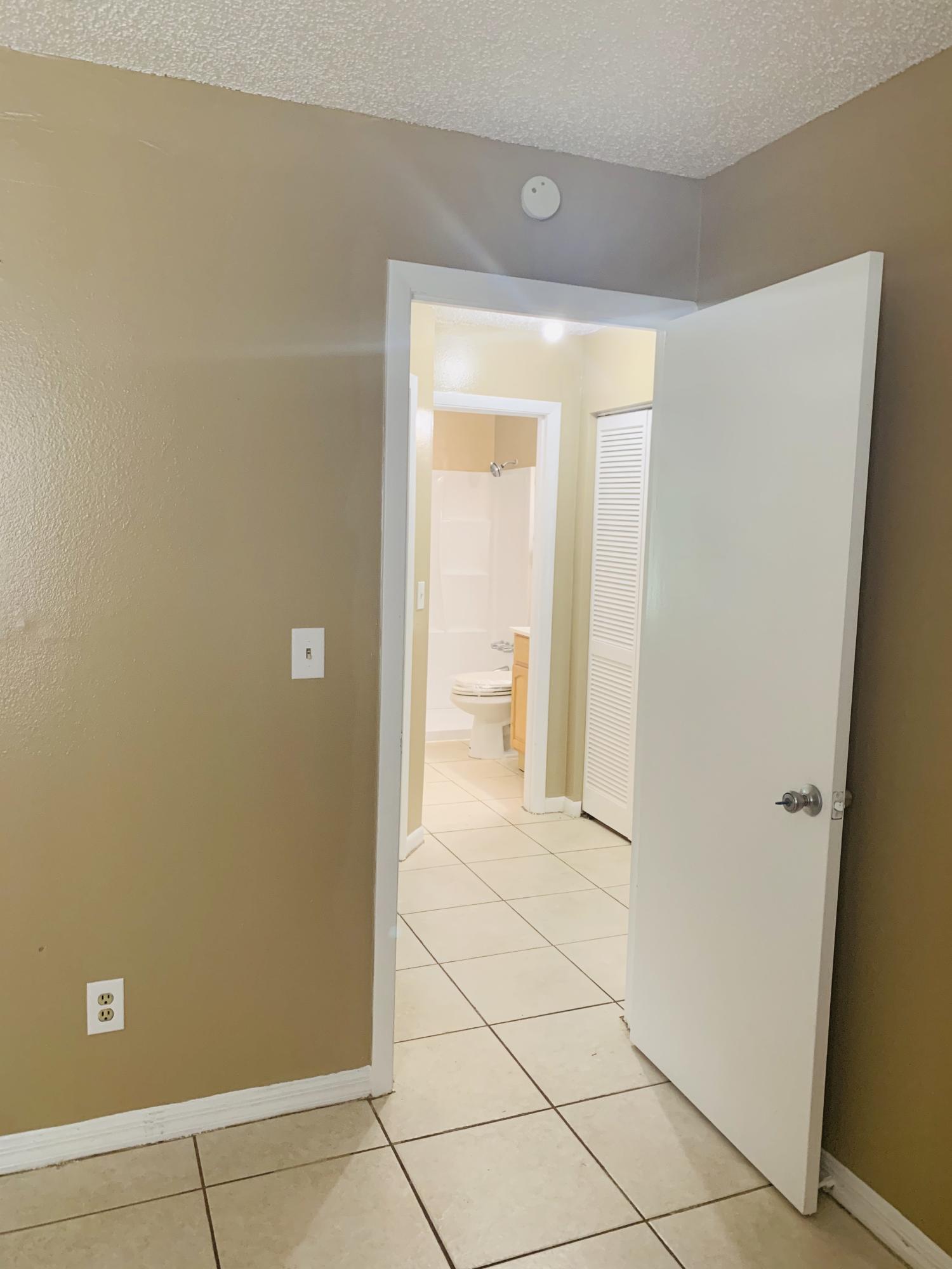 3370 Northwest 40th Drive Okeechobee, FL 34972 - Photo 8 of 14 a view of a room with an empty space and a window