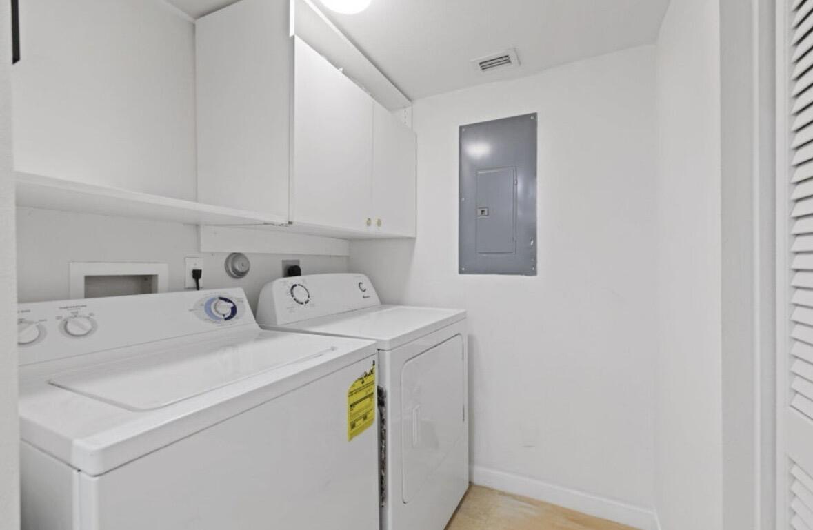 3143 Clint Moore Road, Unit 107 Boca Raton, FL 33496 - Photo 16 of 28 a utility room with dryer and washer