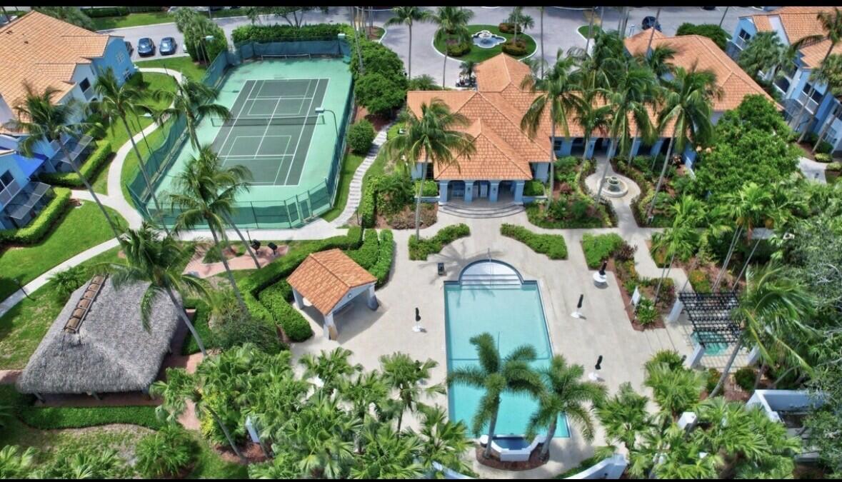3143 Clint Moore Road, Unit 107 Boca Raton, FL 33496 - Photo 26 of 28 an aerial view of a house with a yard and garden