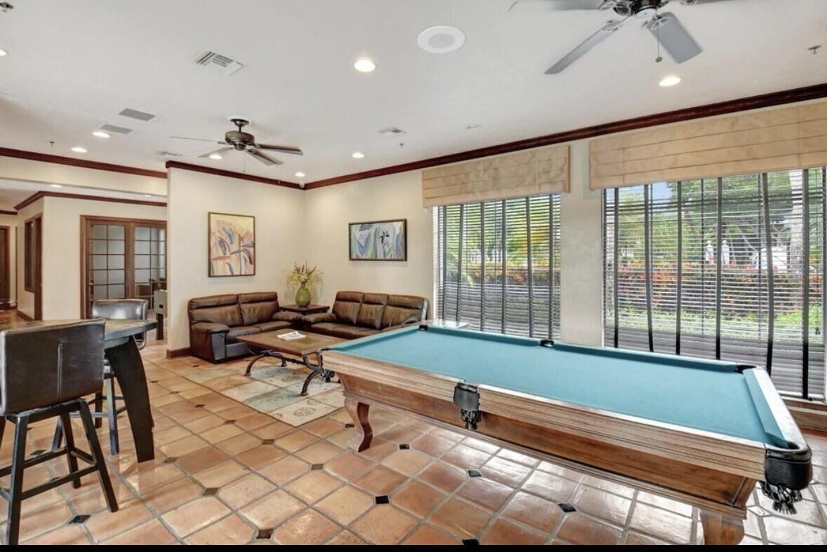 3143 Clint Moore Road, Unit 107 Boca Raton, FL 33496 - Photo 27 of 28 a reading room with furniture and a large window