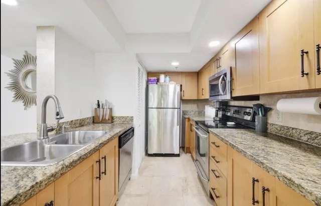 a wooden bench with some trees