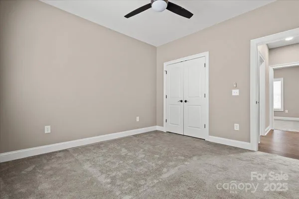 an empty room with fan