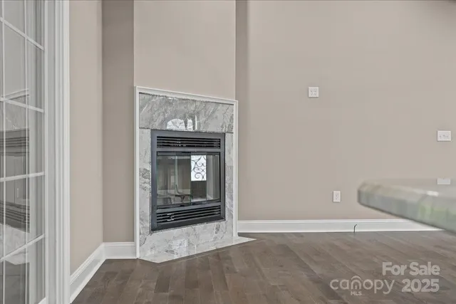 a view of an empty room with a fireplace