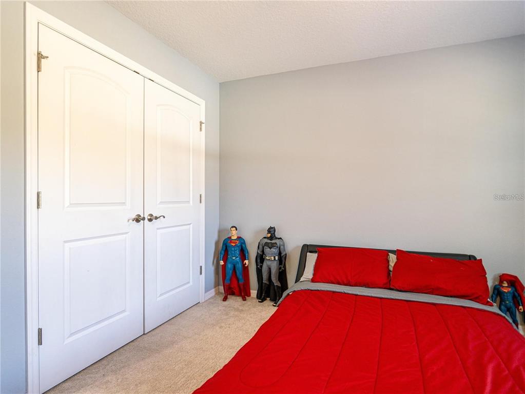 10688 Southwest 129th Terrace Road Dunnellon, FL 34432 - Photo 27 of 35 a bed room with a bed and a window