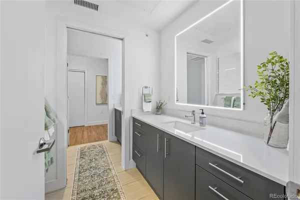 a en suite bathroom with a sink and mirror