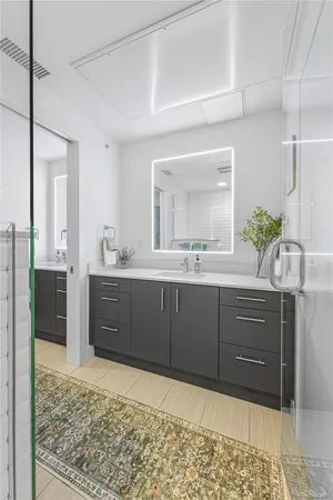 a room with a sink and a mirror