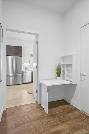 a view of a hallway with washer and dryer