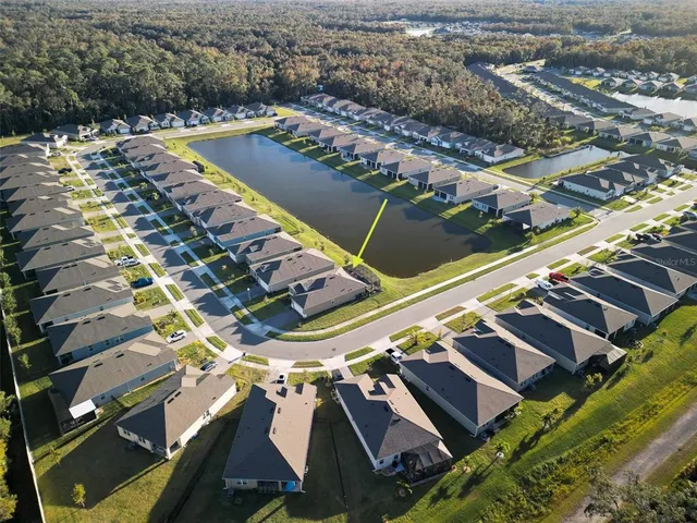 a kitchen with stainless steel appliances a stove a sink a refrigerator a center island and a refrigerator