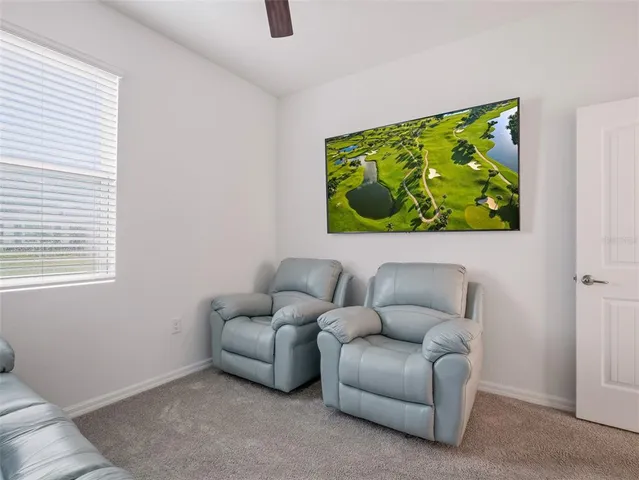 a view of swimming pool with a balcony