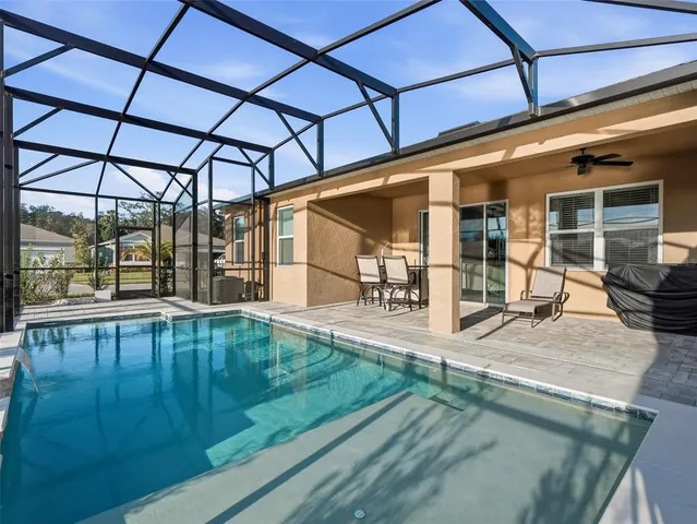 a view of a balcony with lake view and a floor to ceiling window