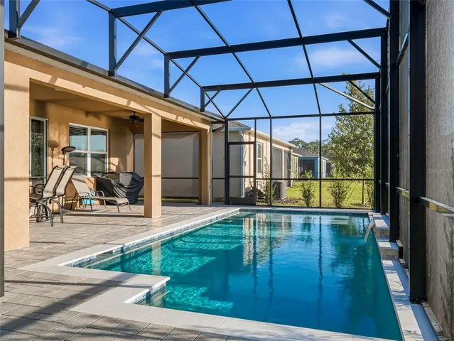 a living room with furniture ceiling fan and a rug