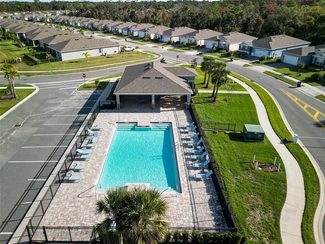 a view of a house with backyard porch and sitting area