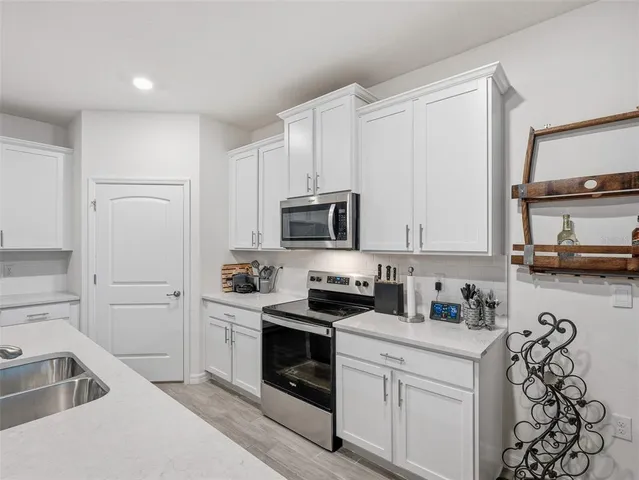 a view of a dining room with furniture and window