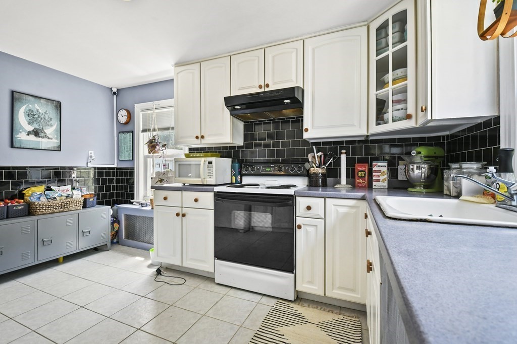 4 Maxdale Road Worcester, MA 01602 - Photo 11 of 28 a kitchen with cabinets and window
