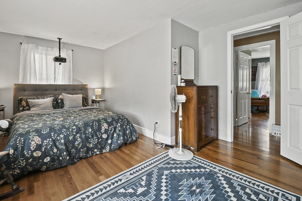 4 Maxdale Road Worcester, MA 01602 - Photo 17 of 28 a bedroom with a bed and wooden floor