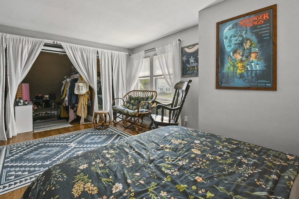 4 Maxdale Road Worcester, MA 01602 - Photo 18 of 28 a bed room with a bed and a painting on the wall