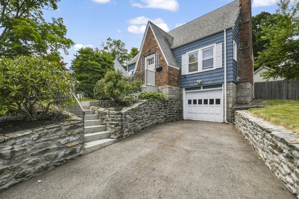 4 Maxdale Road Worcester, MA 01602 - Photo 23 of 28 a front view of a house with a yard