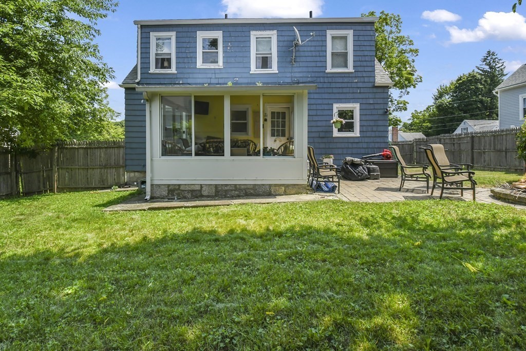 4 Maxdale Road Worcester, MA 01602 - Photo 24 of 28 a view of a brick house with a yard chair and table